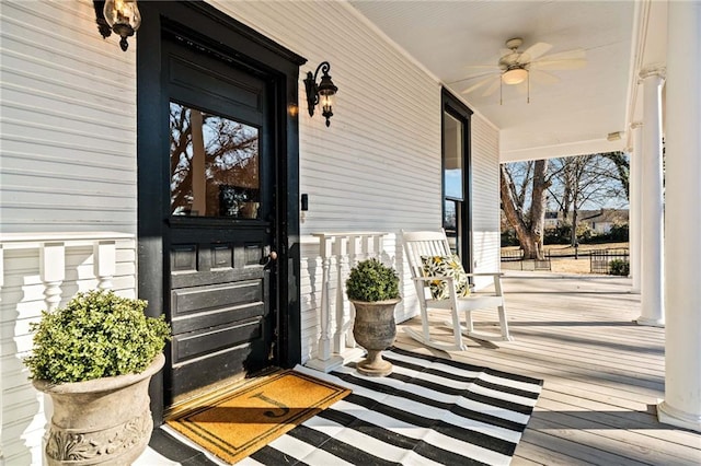 view of exterior entry featuring ceiling fan