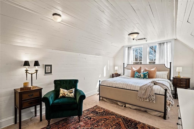 carpeted bedroom with lofted ceiling and wood ceiling