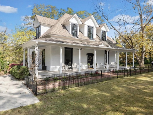 country-style home with a front lawn and a porch