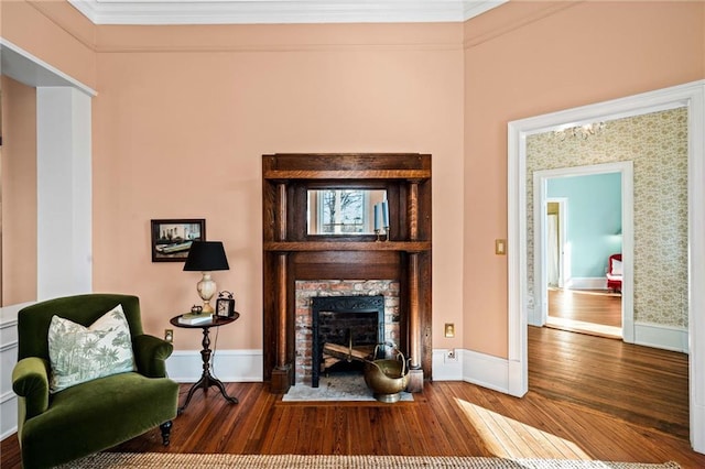 living room featuring crown molding and wood-type flooring