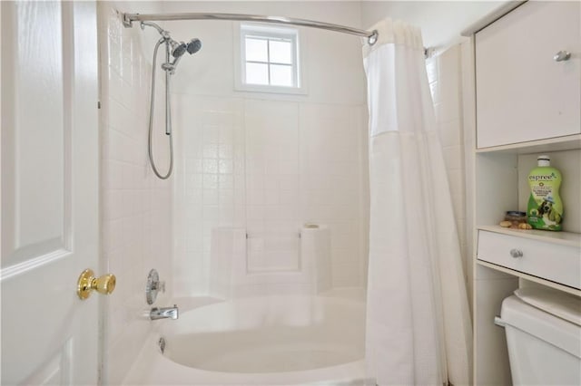 bathroom with toilet and shower / bath combo