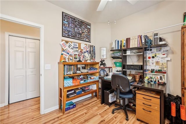 office space featuring ceiling fan and light hardwood / wood-style floors