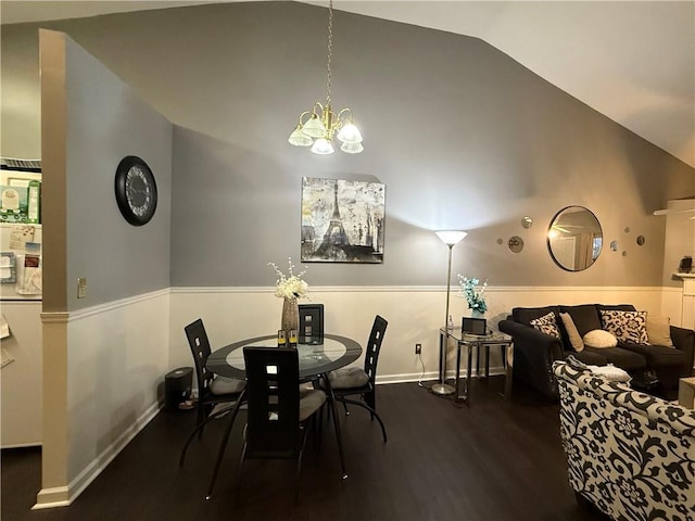 dining area with a chandelier, high vaulted ceiling, baseboards, and dark wood-style flooring