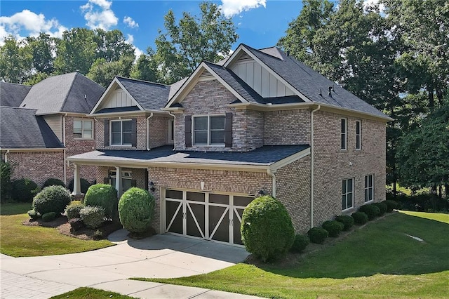 craftsman-style home featuring a front yard and a garage