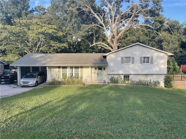 split level home with a front yard and a carport