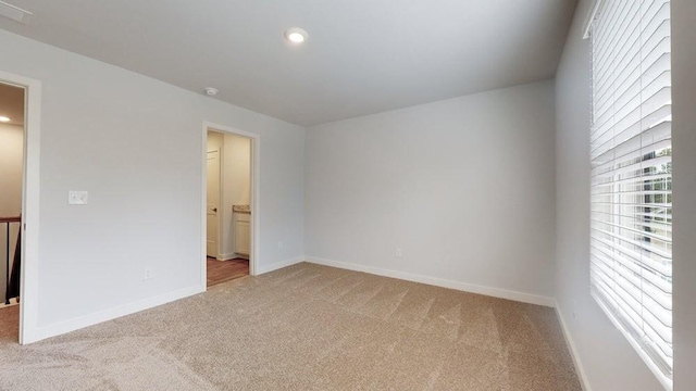 142 Post Oak Dr, Jackson, GA 30233 - unfurnished bedroom featuring light colored carpet, baseboards, recessed lighting, and ensuite bath
