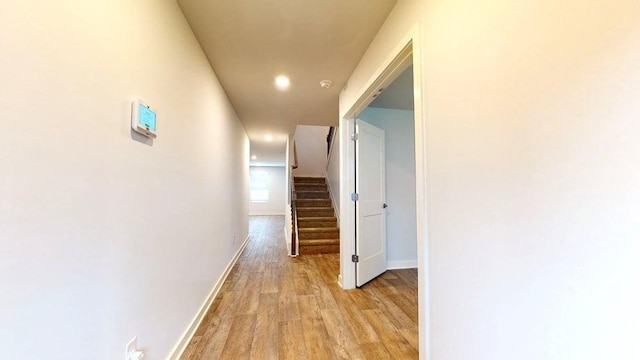 142 Post Oak Dr, Jackson, GA 30233 - corridor featuring light wood finished floors, baseboards, stairway, and recessed lighting