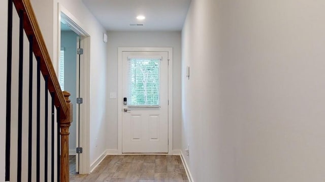 142 Post Oak Dr, Jackson, GA 30233 - entryway with light wood finished floors, stairs, and baseboards