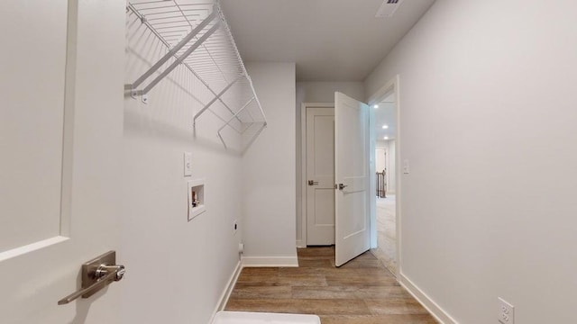 142 Post Oak Dr, Jackson, GA 30233 - laundry area featuring hookup for a washing machine, light wood finished floors, baseboards, and hookup for an electric dryer