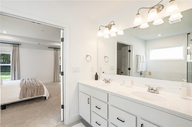 7985 Welch Ml, Ball Ground, GA 30107 - ensuite bathroom featuring double vanity, plenty of natural light, and baseboards