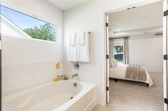 7985 Welch Ml, Ball Ground, GA 30107 - bathroom with ensuite bath, a bath, and plenty of natural light