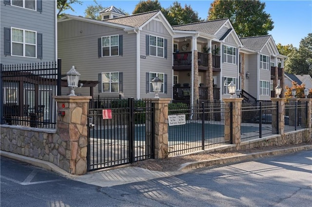 1102 Madison Ln SE Unit 1102, Smyrna, GA 30080 - view of property featuring a fenced front yard and board and batten siding
