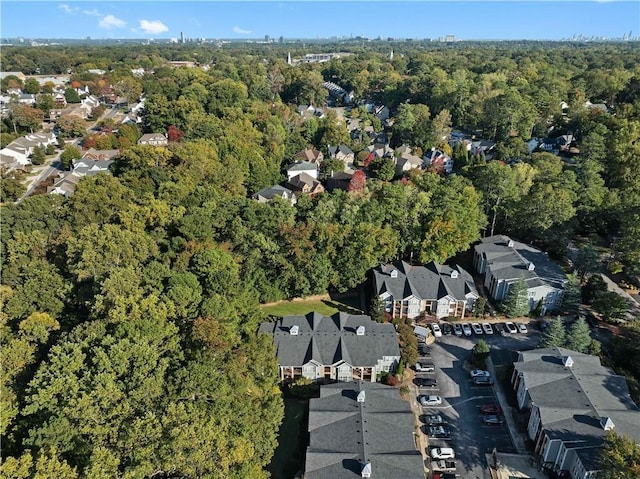 1102 Madison Ln SE Unit 1102, Smyrna, GA 30080 - aerial view of property and surrounding area featuring a heavily wooded area and nearby suburban area