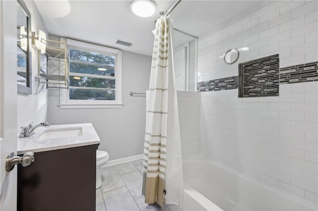 full bathroom featuring vanity, toilet, tile patterned flooring, and shower / tub combo