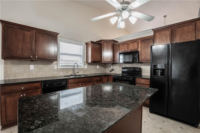 kitchen with sink, dark stone countertops, backsplash, and black appliances