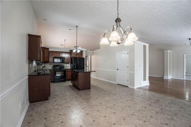 kitchen featuring a center island, decorative light fixtures, a textured ceiling, black appliances, and sink