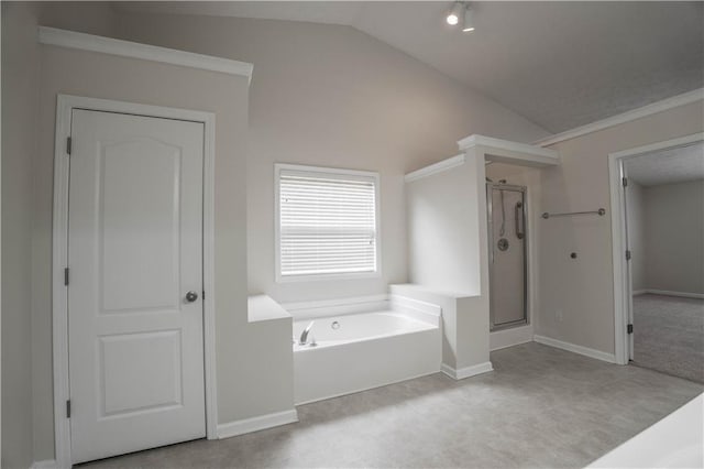 bathroom featuring shower with separate bathtub and vaulted ceiling