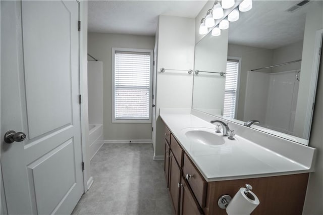 bathroom featuring a healthy amount of sunlight and vanity