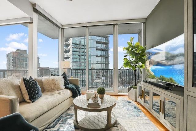 sunroom featuring a city view