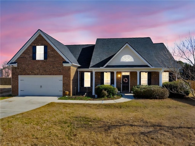 traditional home with driveway, brick siding, and a front lawn