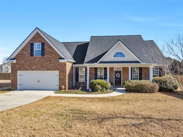 view of front of property with a garage, a front lawn, concrete driveway, and brick siding