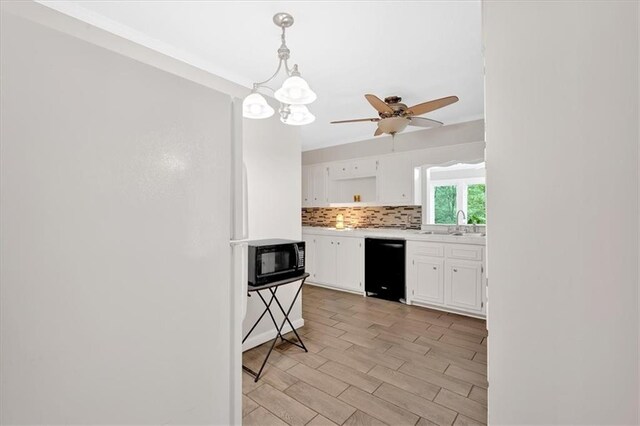 kitchen with black appliances, open shelves, white cabinets, decorative backsplash, and light countertops