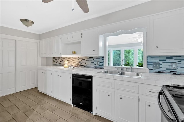 kitchen featuring a sink, black appliances, a ceiling fan, and light countertops
