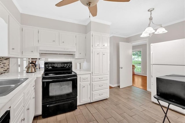 kitchen with black electric range, under cabinet range hood, a ceiling fan, white cabinetry, and light countertops