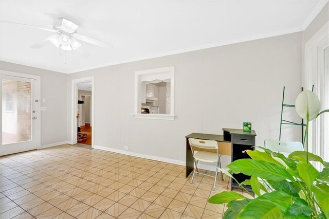 office area with crown molding, baseboards, and a ceiling fan