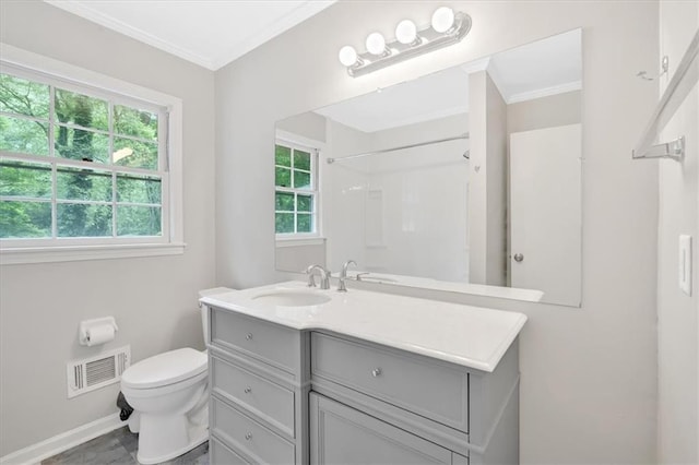 bathroom with ornamental molding, toilet, baseboards, vanity, and a shower