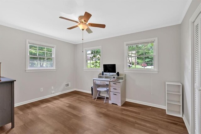 office featuring wood finished floors, ceiling fan, ornamental molding, and baseboards