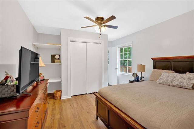bedroom featuring light wood finished floors, a closet, and ceiling fan
