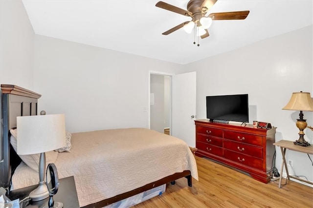 bedroom with wood finished floors and ceiling fan