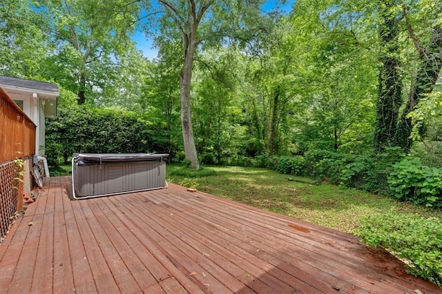 wooden deck featuring a hot tub