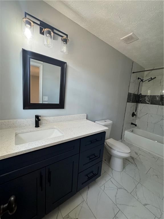 full bathroom featuring vanity, a textured ceiling, toilet, and tiled shower / bath combo