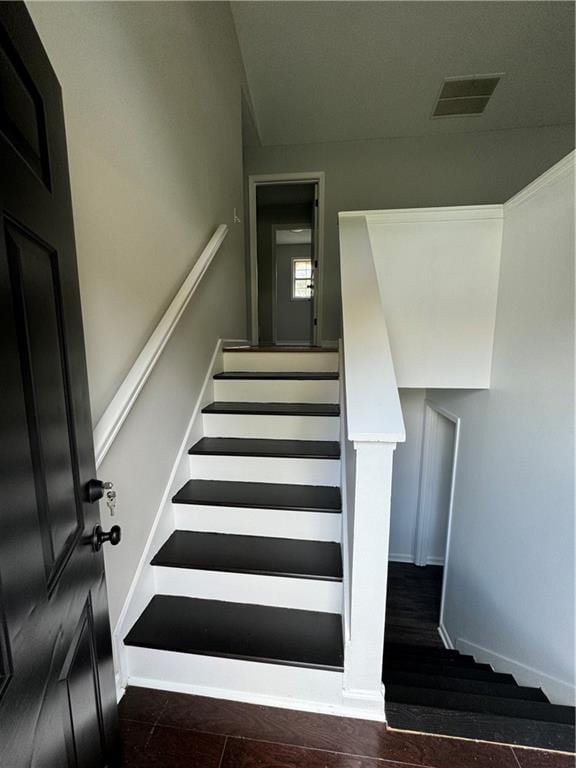 stairs with hardwood / wood-style floors