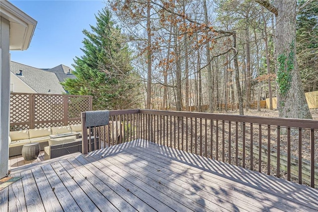 wooden deck with an outdoor living space