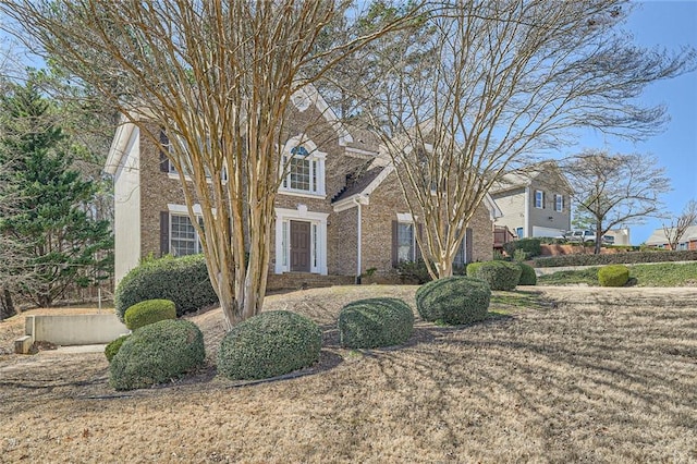 view of front of home with brick siding