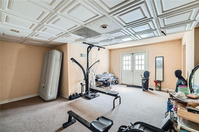 workout area with an ornate ceiling, carpet, french doors, visible vents, and baseboards