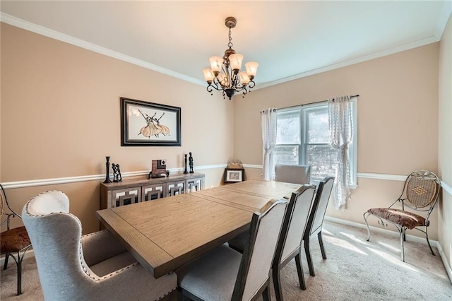 dining area featuring a chandelier, light carpet, crown molding, and baseboards