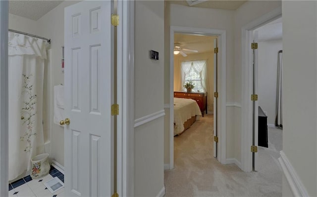 bathroom featuring shower with separate bathtub, sink, and tile patterned flooring