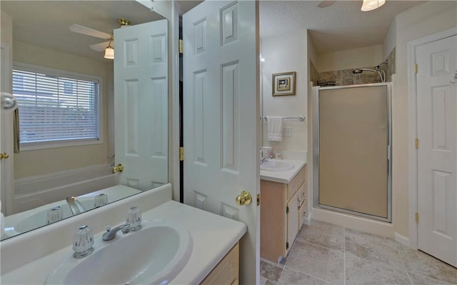 carpeted bedroom featuring ceiling fan and a tray ceiling
