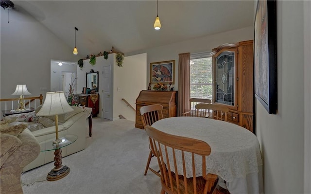 interior space featuring a wealth of natural light, lofted ceiling, and an inviting chandelier