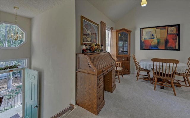 carpeted living room featuring a stone fireplace, vaulted ceiling, and ceiling fan