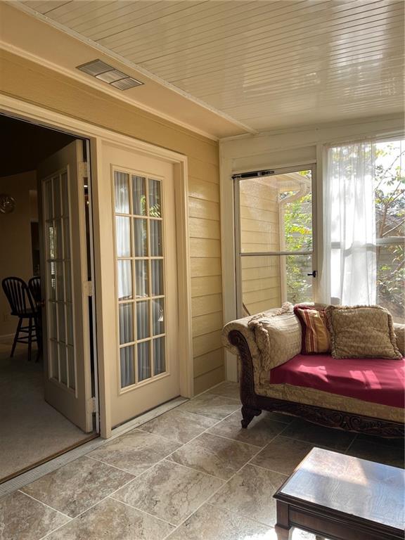 sunroom / solarium with wood ceiling