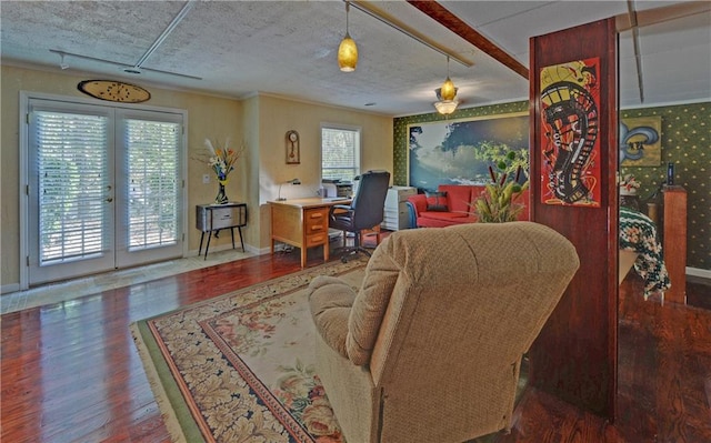 living room with a drop ceiling and hardwood / wood-style floors