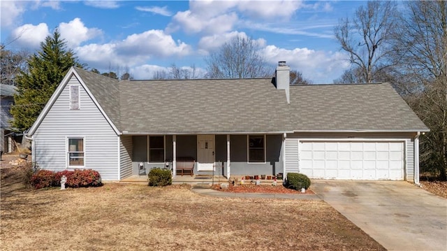 view of front of property featuring a garage and covered porch