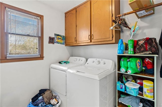 laundry area with cabinets and washing machine and dryer