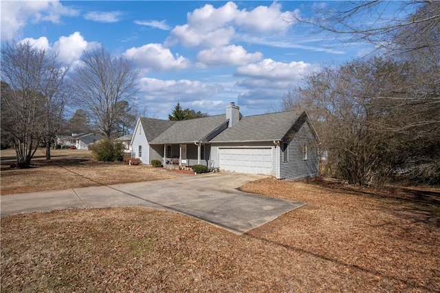 single story home featuring a porch and a garage