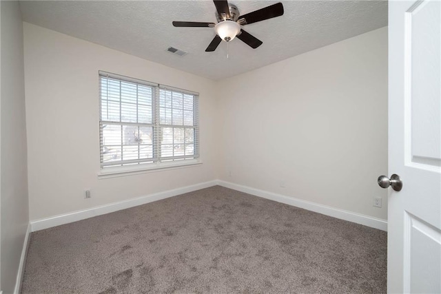 empty room with carpet and ceiling fan